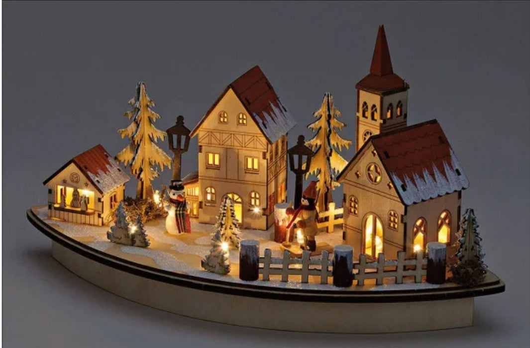 Decorated and illuminated winter landscape made of filigree wood. Dimensions 36 x 20 x 17 cm. Idyllic Christmas decoration