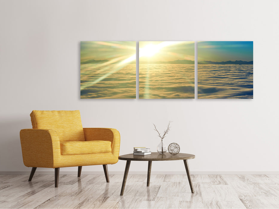 Panoramic 3-piece canvas picture Sunrise above the clouds