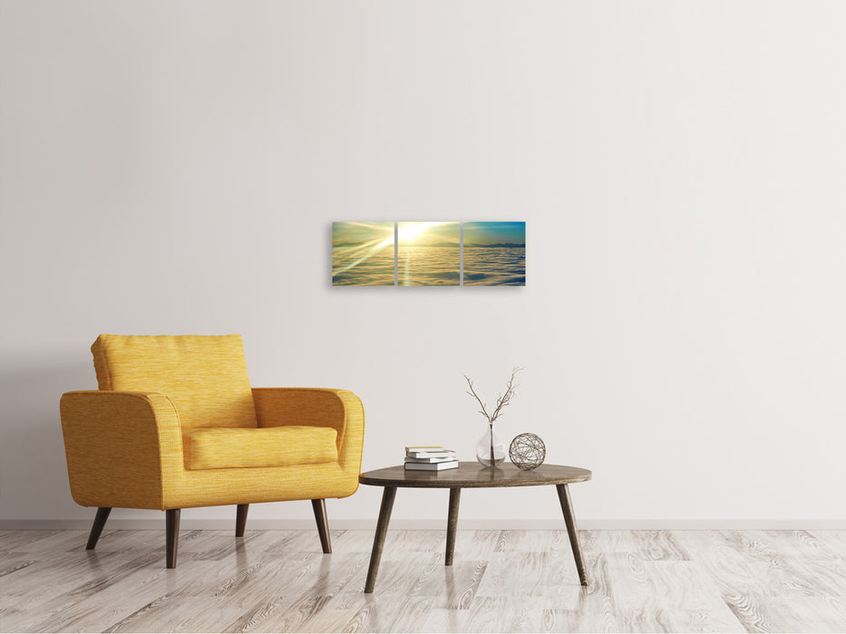 Panoramic 3-piece canvas picture Sunrise above the clouds