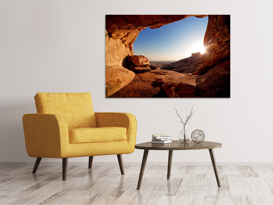 Canvas print Sunset in front of the cave