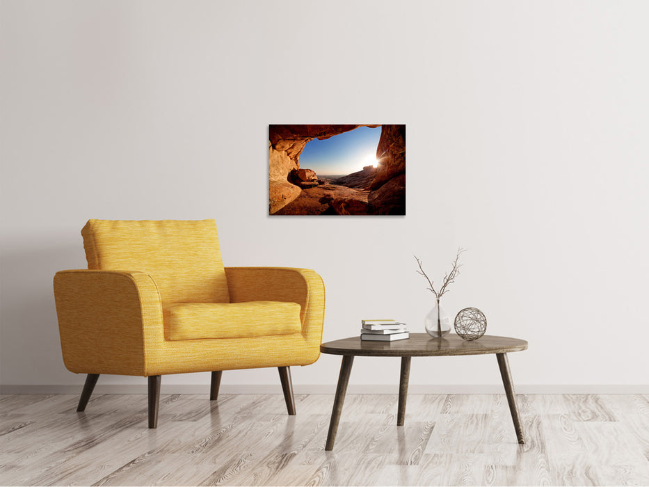 Canvas print Sunset in front of the cave