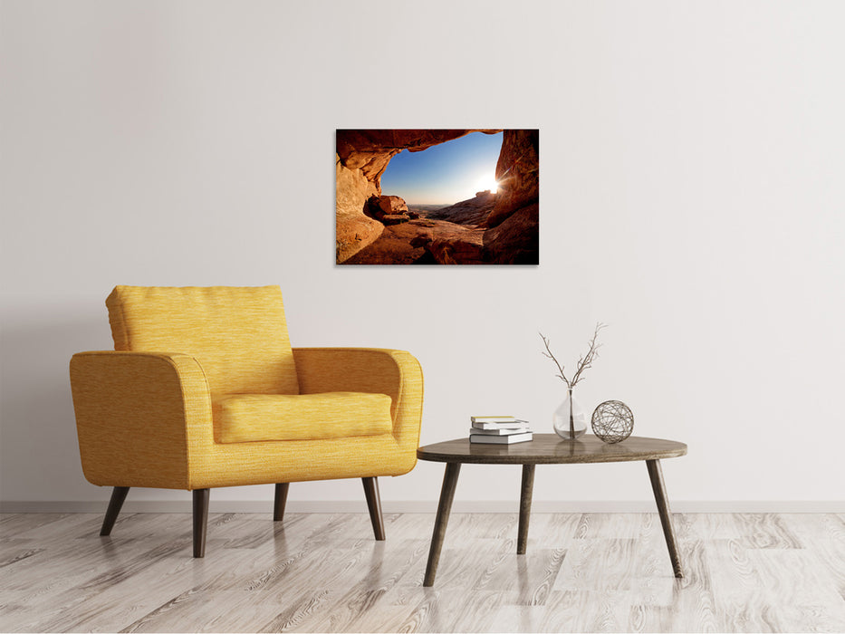 Canvas print Sunset in front of the cave