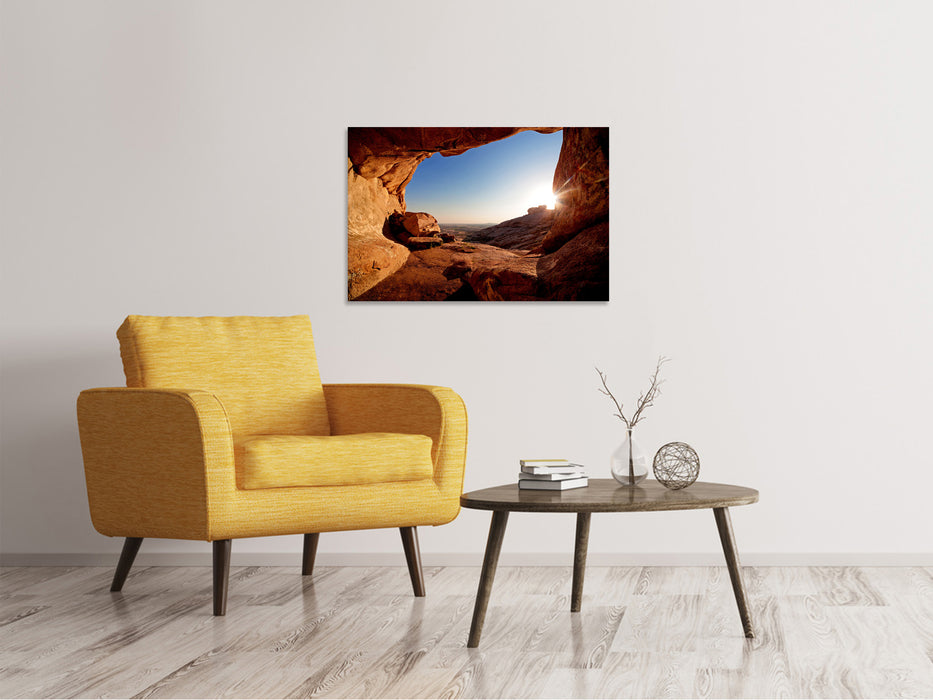 Canvas print Sunset in front of the cave