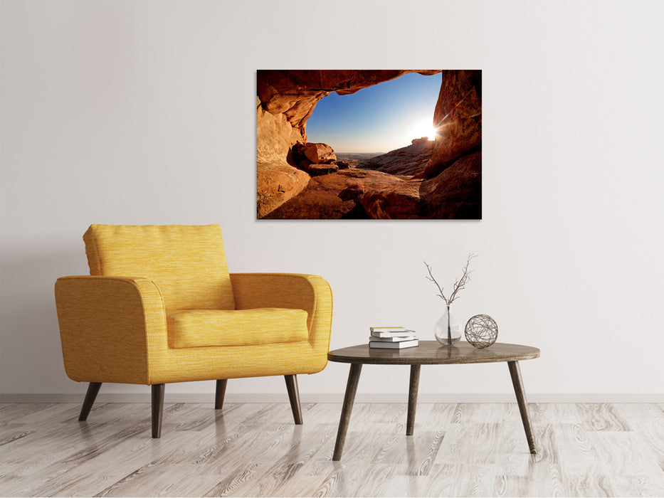 Canvas print Sunset in front of the cave