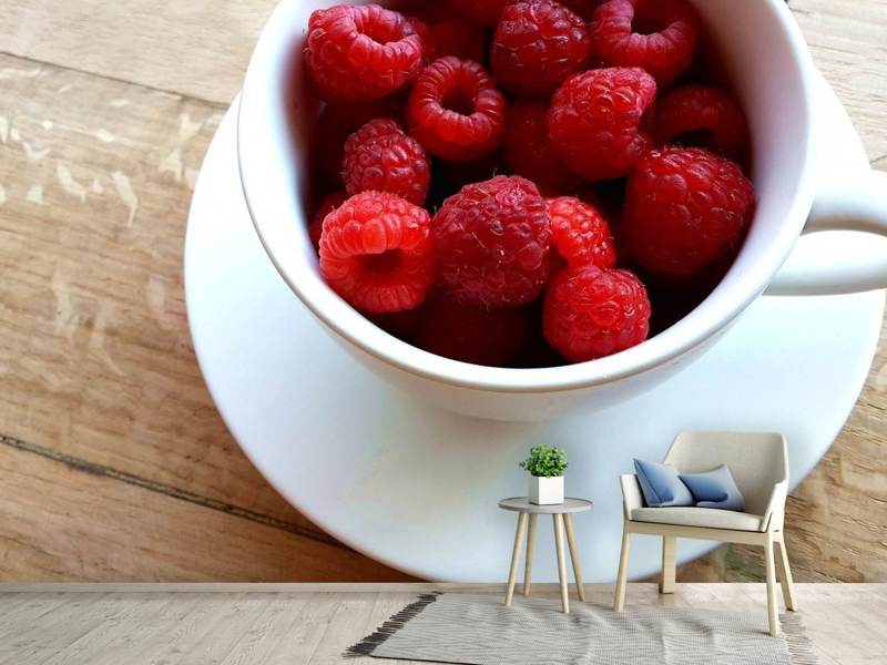 Fototapete Eine Tasse Himbeeren