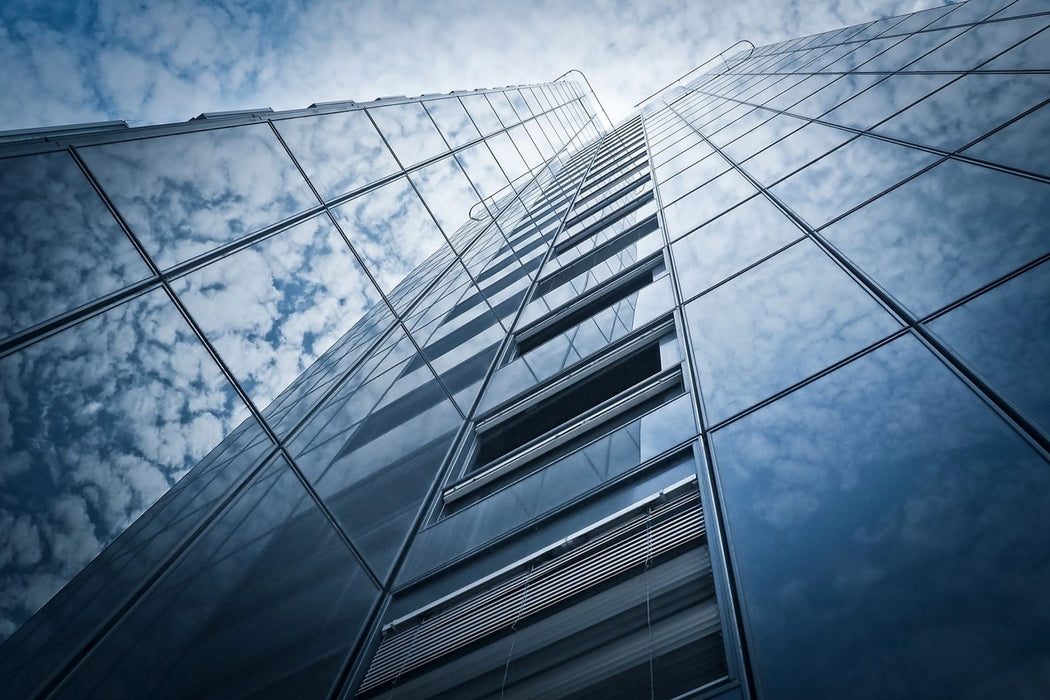 Fototapete Hochhaus in den Wolken