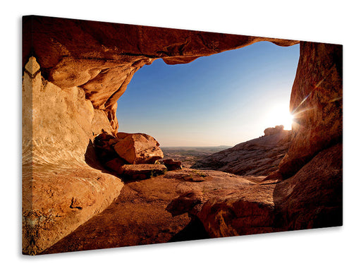 Leinwandbild Sonnenuntergang vor der Höhle