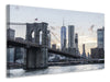 Leinwandbild Die Brooklyn Bridge am Abend