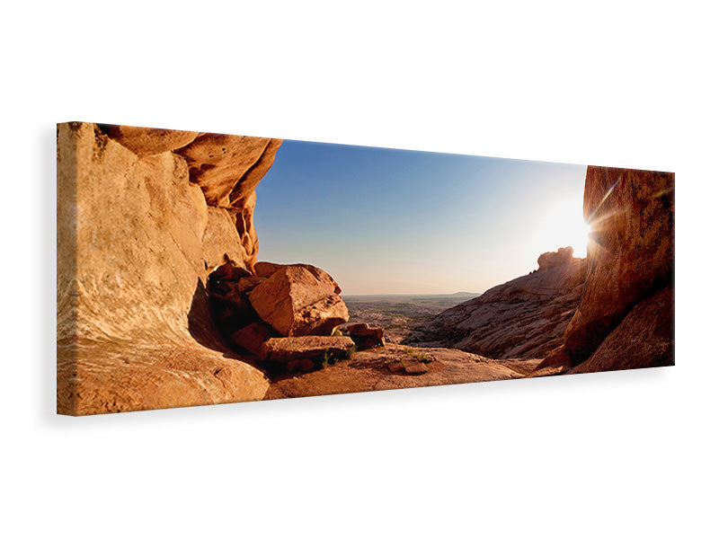 Leinwandbild Panorama Sonnenuntergang vor der Höhle