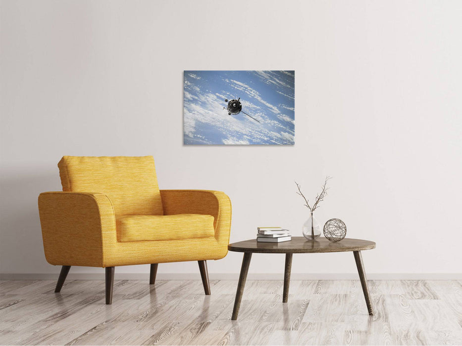 Tableaux sur toile Un satellite au-dessus des nuages