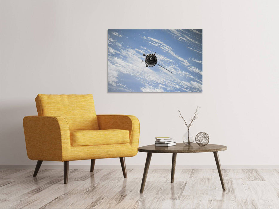 Tableaux sur toile Un satellite au-dessus des nuages