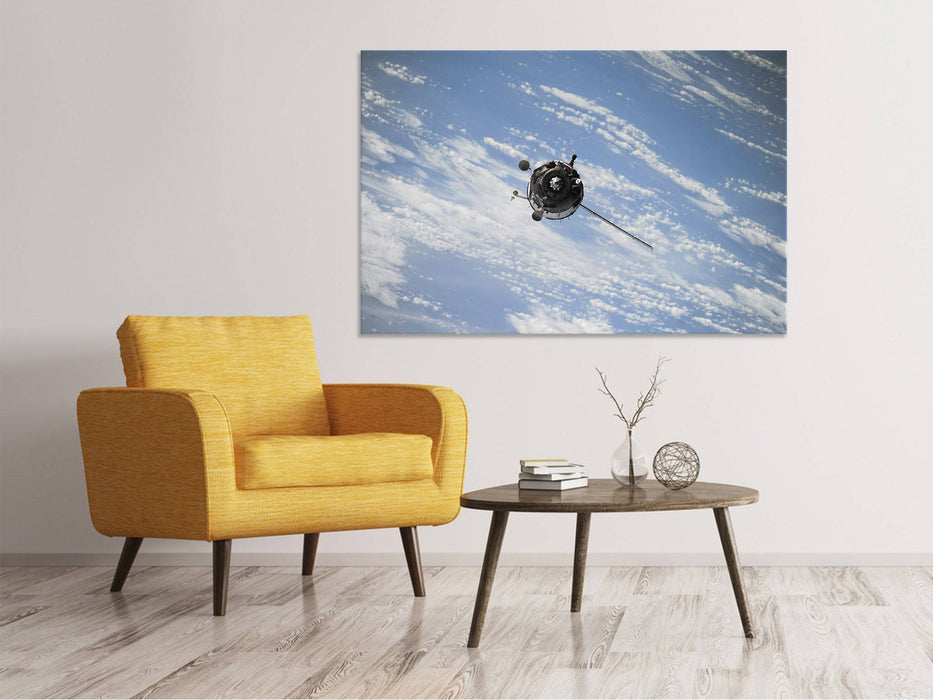 Tableaux sur toile Un satellite au-dessus des nuages