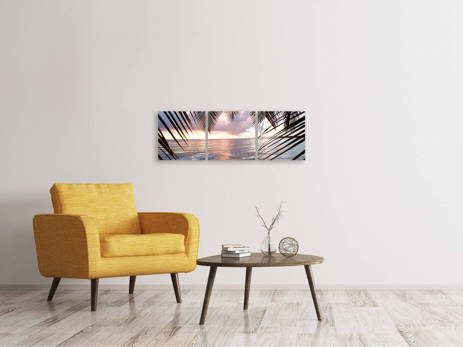 Panoramic 3-piece canvas picture Under palm leaves