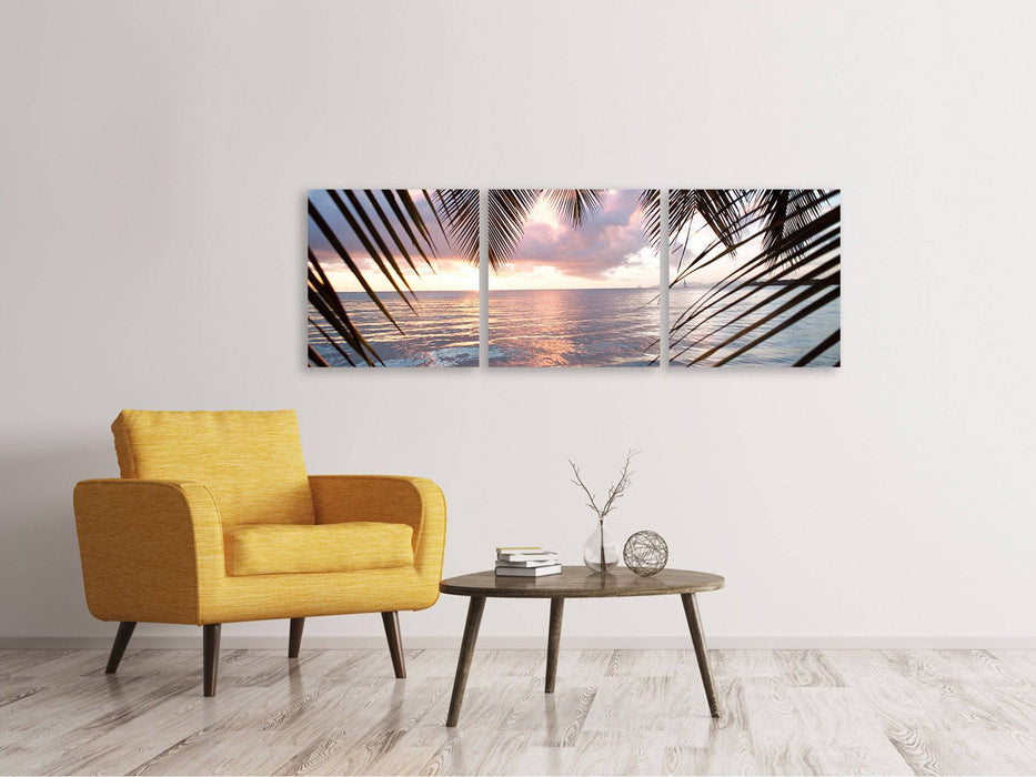 Panoramic 3-piece canvas picture Under palm leaves