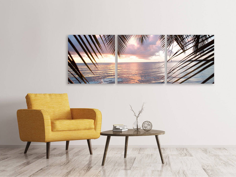 Panoramic 3-piece canvas picture Under palm leaves