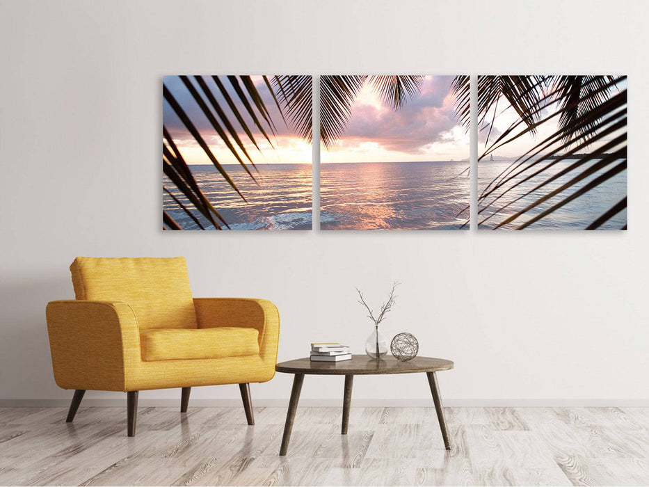 Panoramic 3-piece canvas picture Under palm leaves