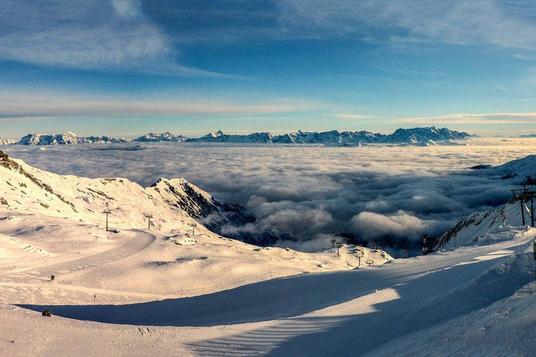 Papier peint Au-dessus des nuages ​​dans la neige